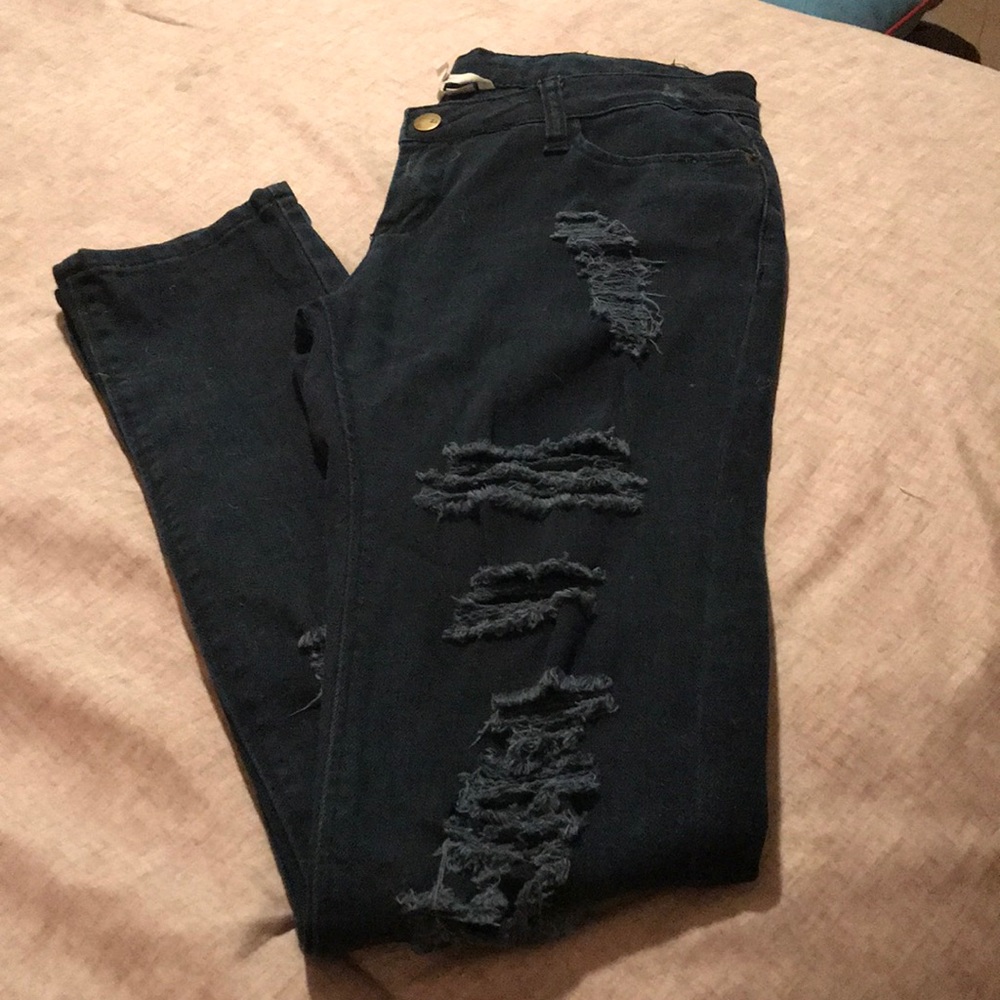 Dark blue skinny jeans w/slit wholes